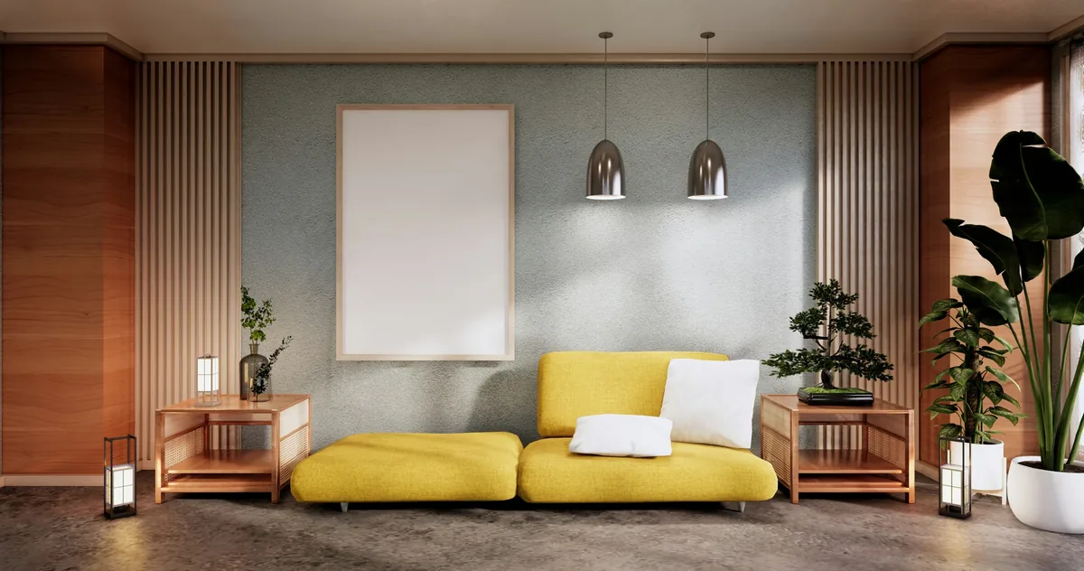 Living room with a yellow sofa, timber slat panelling and two pendant lights